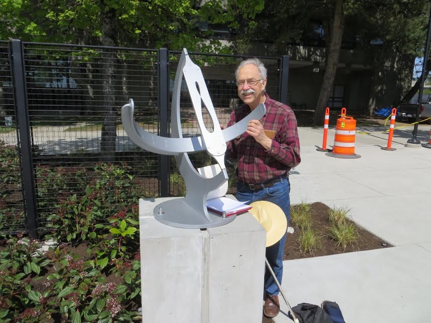 Dr. Berggren with equatorial sundial in front of the Trottier Family Observatory at SFU.